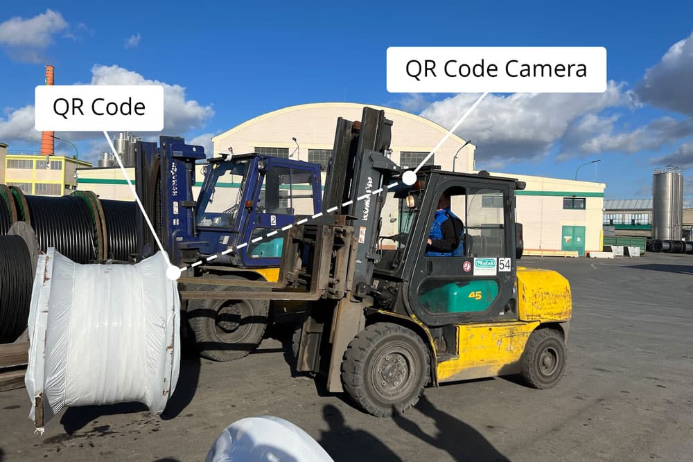 Forklift camera reads the QR code of coil while loading